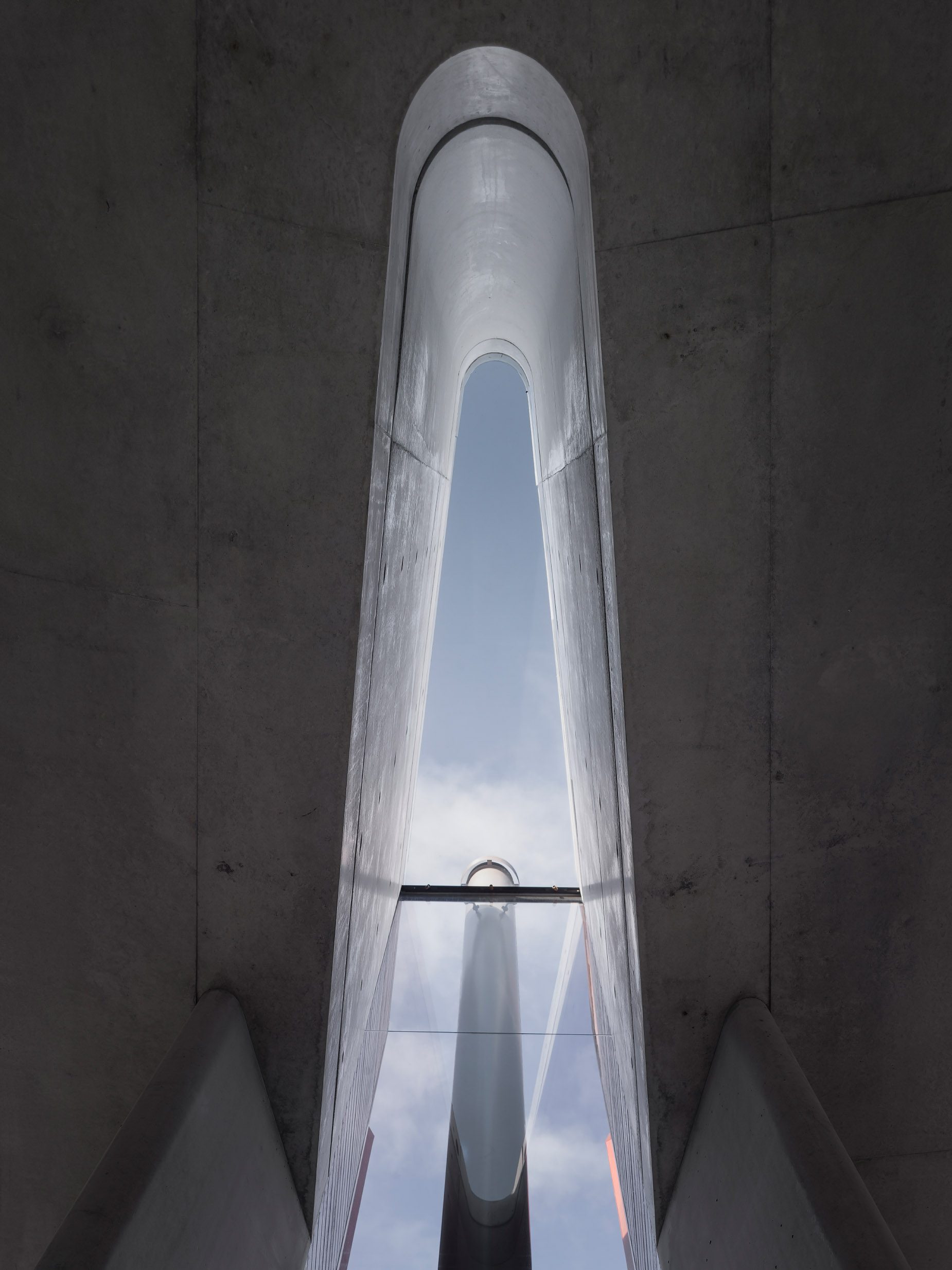 Lurline Bay, board-formed concrete stair void with skylight, built by HP Constructions